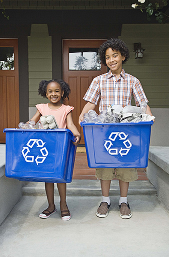 Kids with recycling bins
